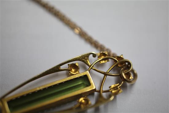 An Edwardian Art Nouveau Murrle Bennett & Co 15ct gold and peridot drop pendant, pendant 2in.